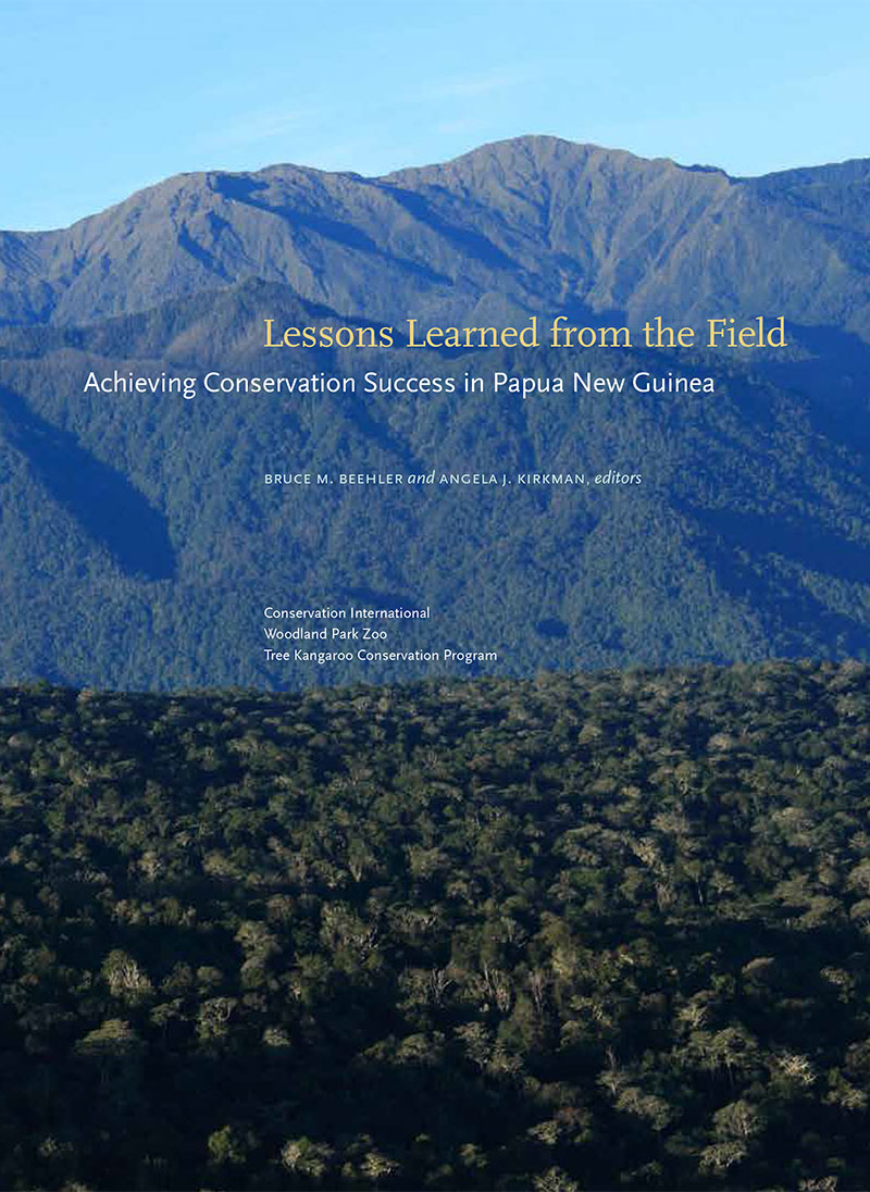 Book cover with forest in the foreground and mountains behind. The title reads “Lessons Learned from the Field: Achieving Conservation Success in Papua New Guinea.”